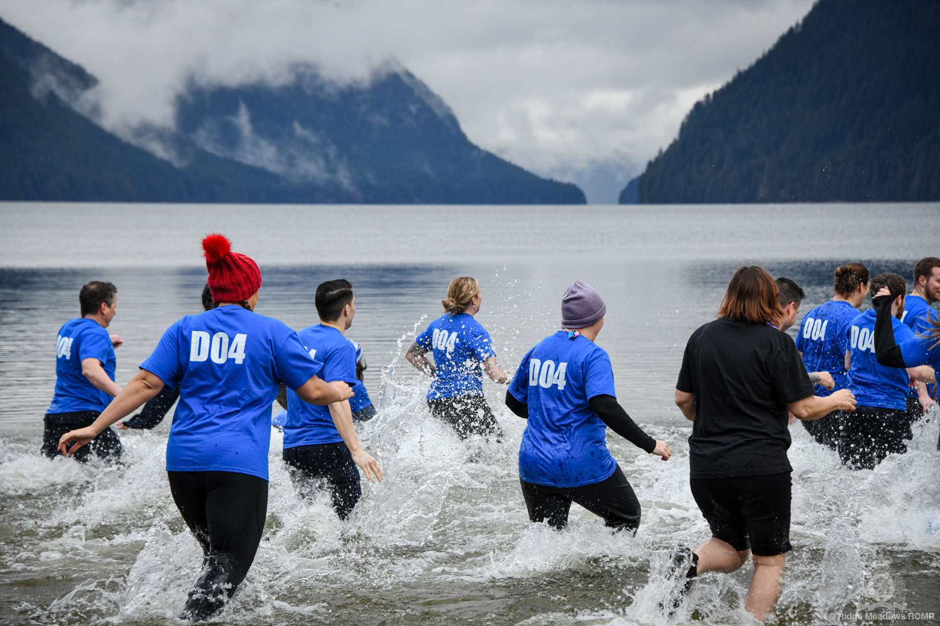 Law Enforcement Torch Run Polar Plunge for Special Olympics BC participants splash into the frigid waters.